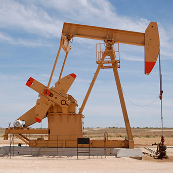 oil rig machinery in the middle of a dessert