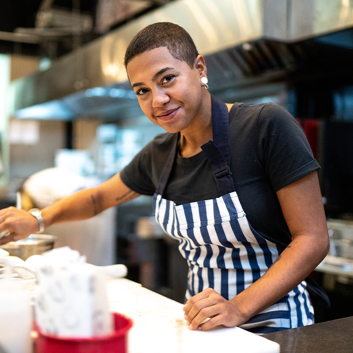 Hospitality worker working at the counter