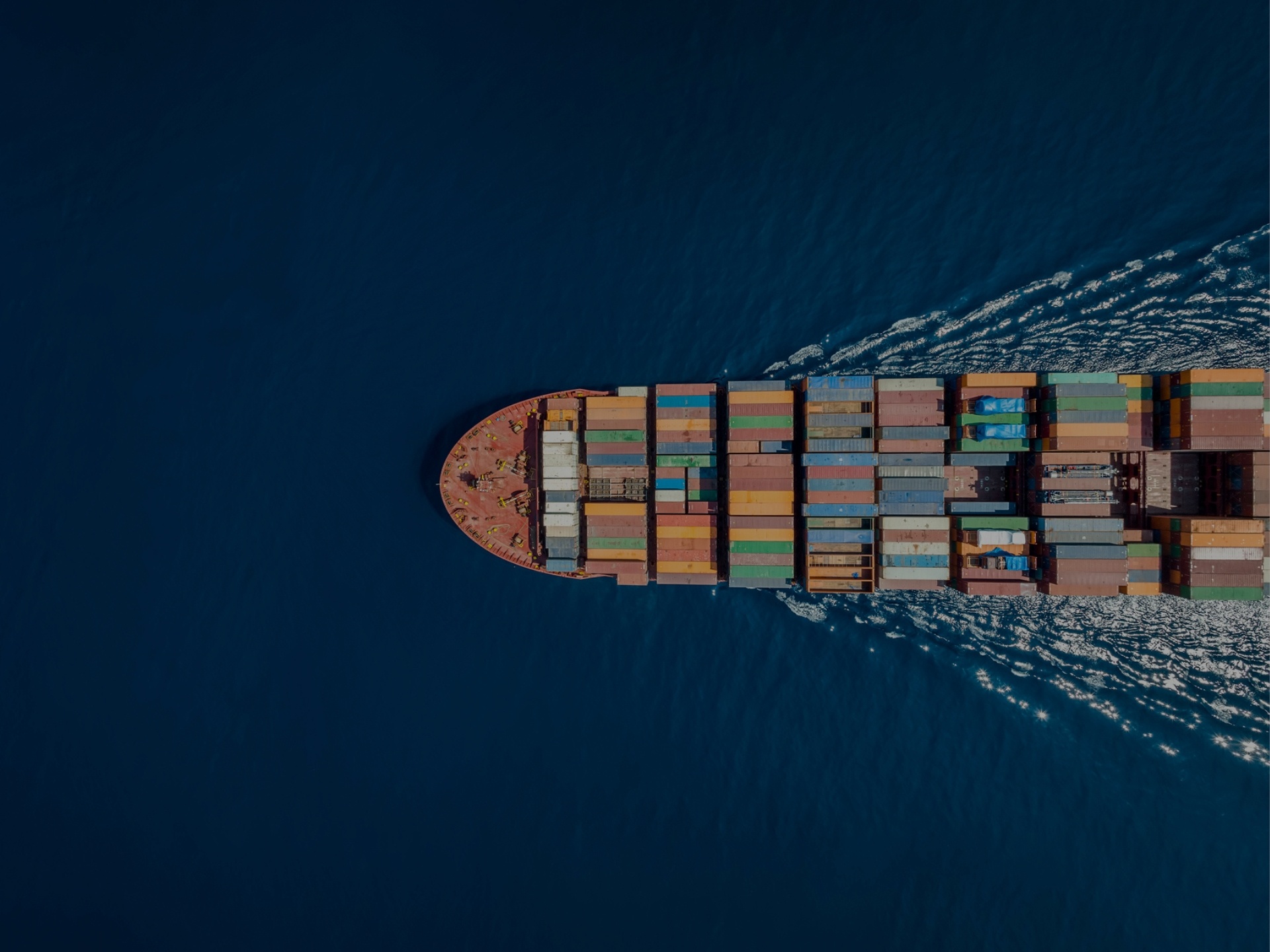 Cargo ship going across water. 