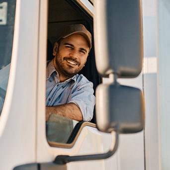 Truck driver looking out the window 