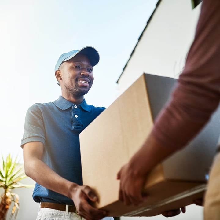 two people handling a box