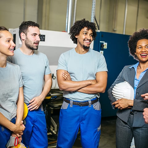 team huddle in warehouse environment